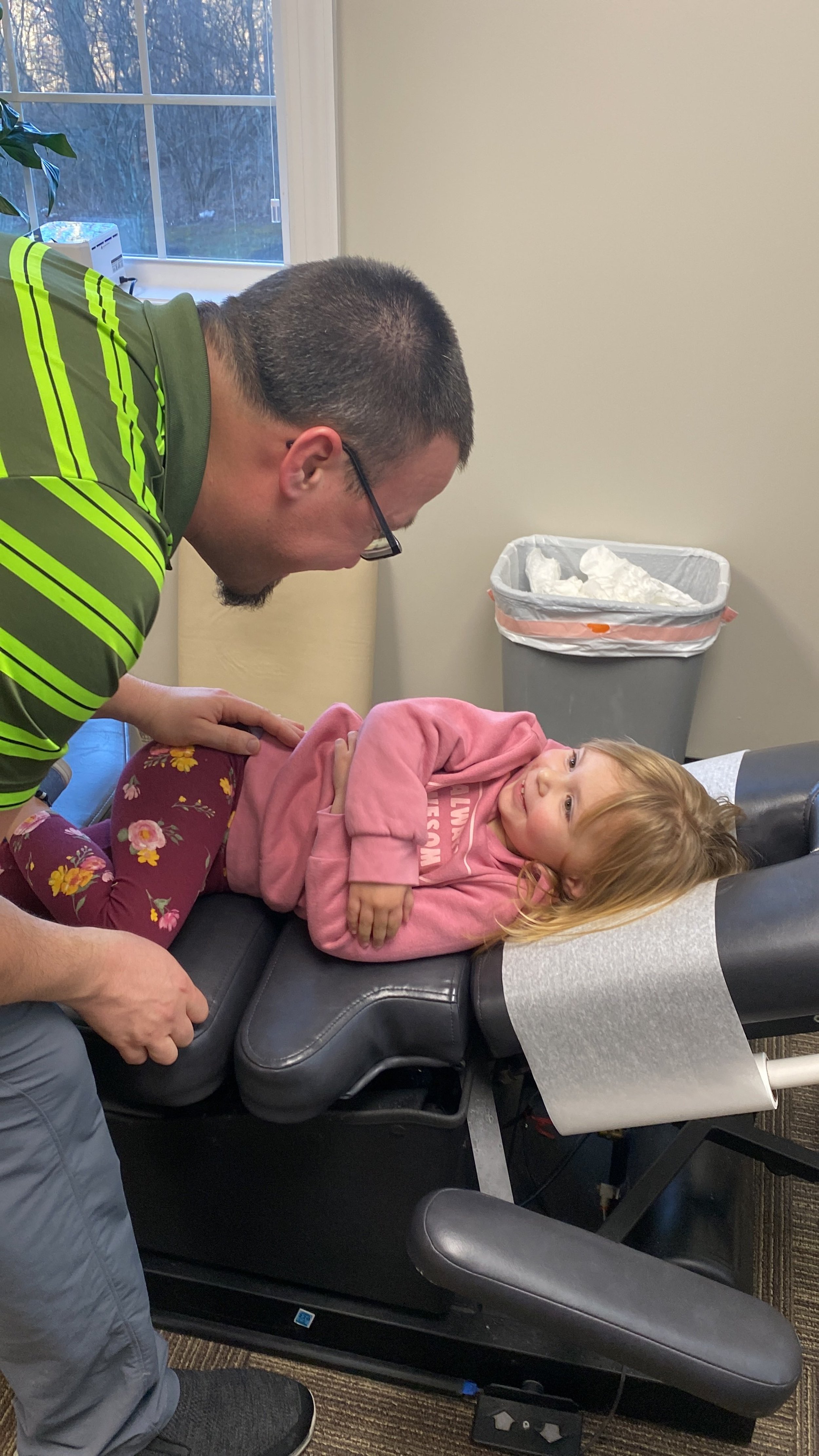Dr. Kyle caring for a young patient