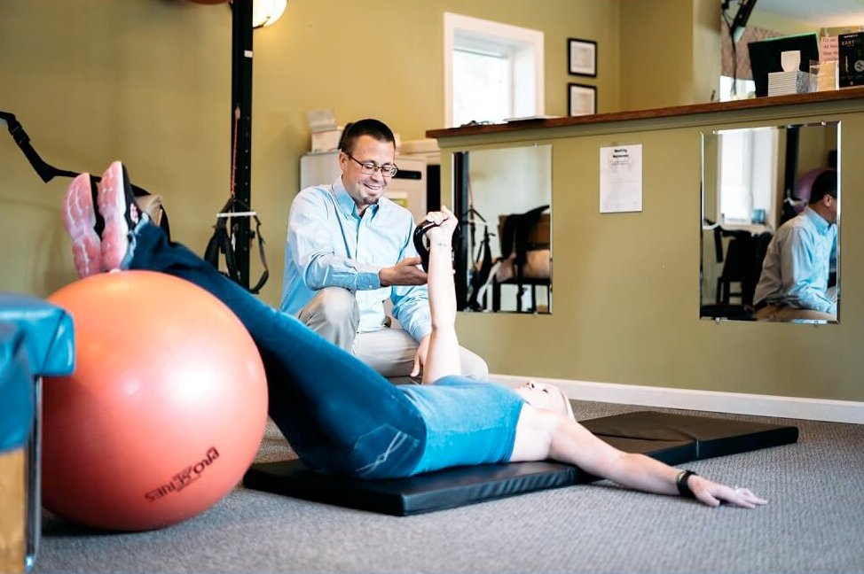 Dr. Kyle helping a patient with rehabilitation